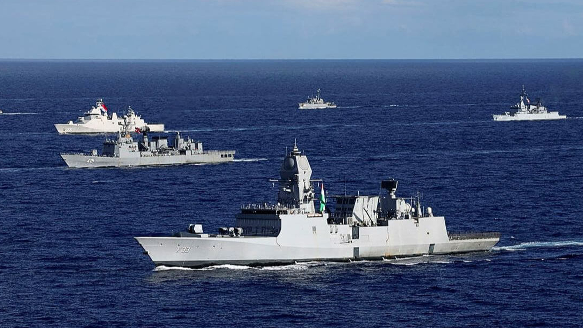 Three men using computers at an office in Ghana