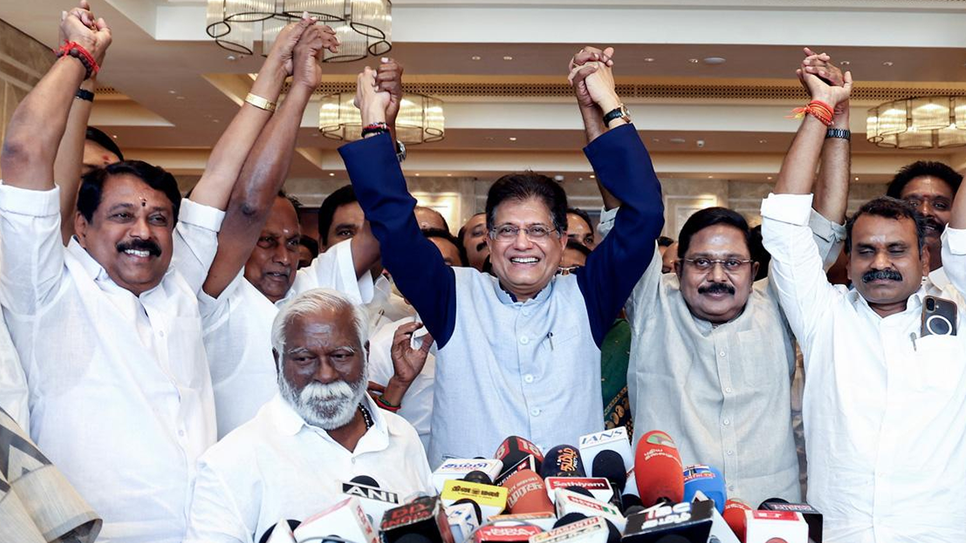 Three men using computers at an office in Ghana