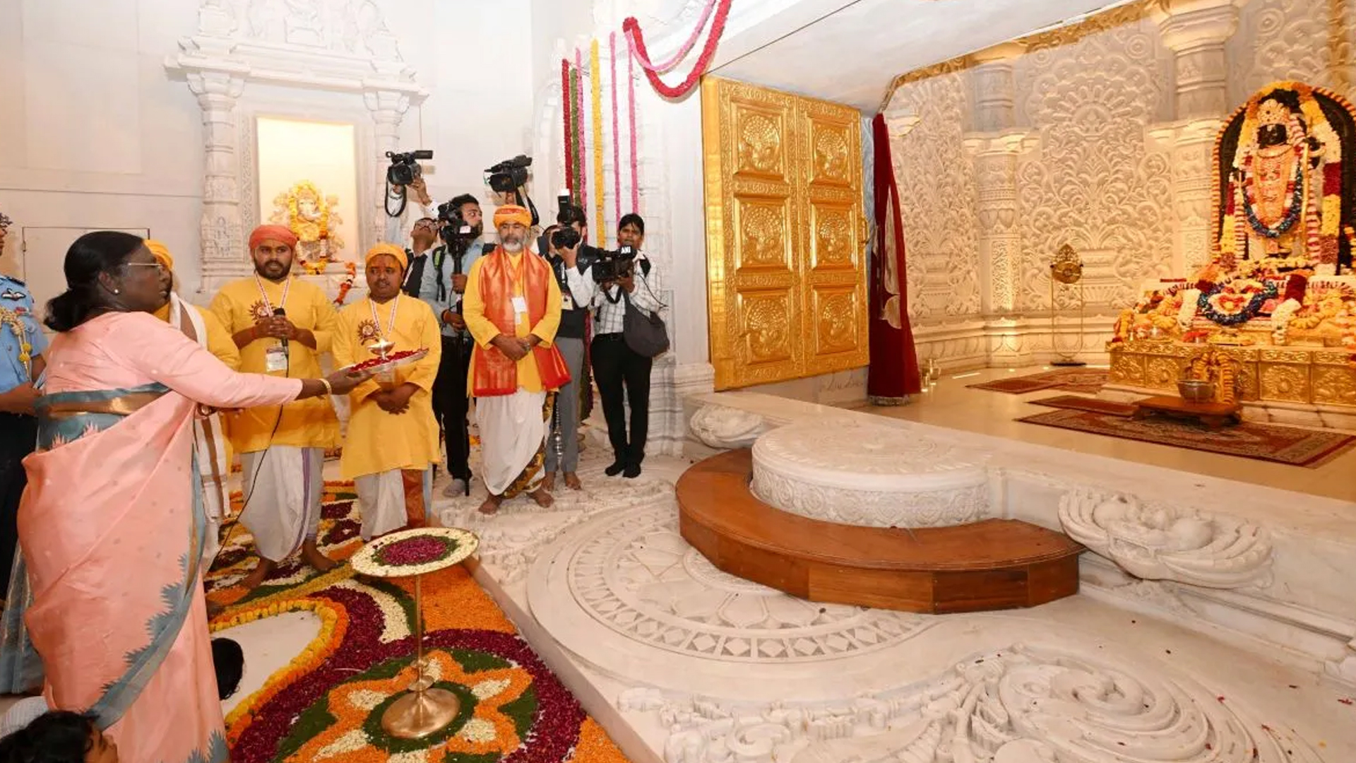 Three men using computers at an office in Ghana
